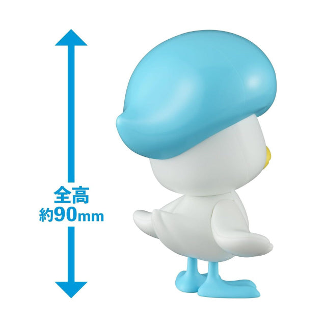 A model kit figure of Quaxly, the Water-type Pokémon, standing with its wings slightly spread. The figure is primarily white with a large, glossy blue head that resembles a beret, featuring a white wavy mark on top. Quaxly has a yellow beak, blue webbed feet, and one eye open while the other is winking. The figure is set against a plain white background.