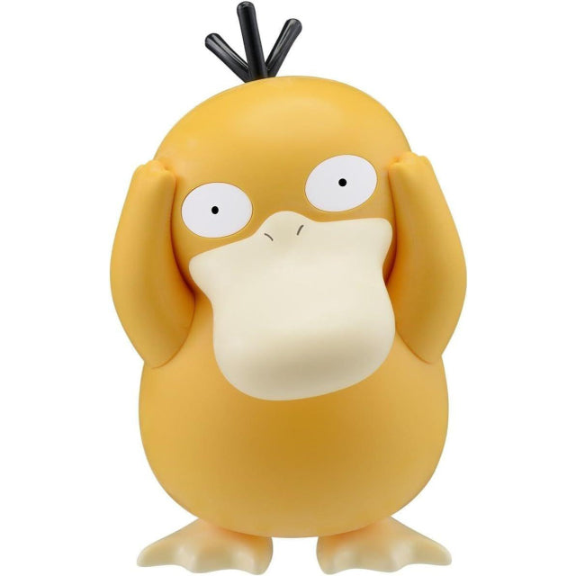 A model kit figure of Psyduck, the yellow, duck-like Pokémon, standing upright with its hands on its head. The figure has a blank, confused expression with wide eyes and a slightly open beak. Its three black head feathers stick up, and its soft, rounded body is a smooth, matte finish. The background is plain white.
