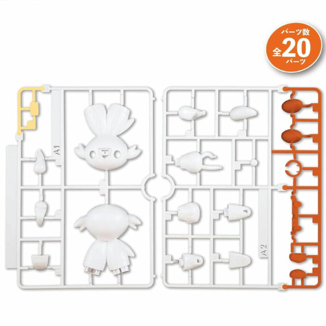 A Bandai Plamo model kit figure of Scorbunny, the white, rabbit-like Fire-type Pokémon, standing in a playful pose with one hand raised to its cheek. The figure has large ears tipped with orange and yellow, red eyes, and an orange nose patch. It also features a red collar-like marking and orange feet. The background is plain white, making Scorbunny's bright colors stand out.