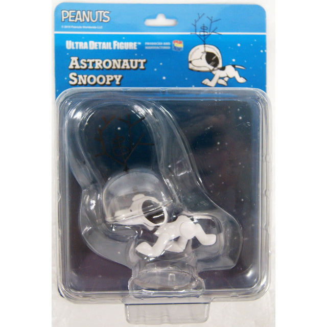 A collectible figure of Snoopy dressed as an astronaut from the Peanuts series. The figure depicts Snoopy in a crawling pose, wearing a transparent space helmet with a black antenna-like structure attached to the top. His classic white body with black ears and a small black collar remain visible. The design is inspired by Snoopy’s role as a space explorer.